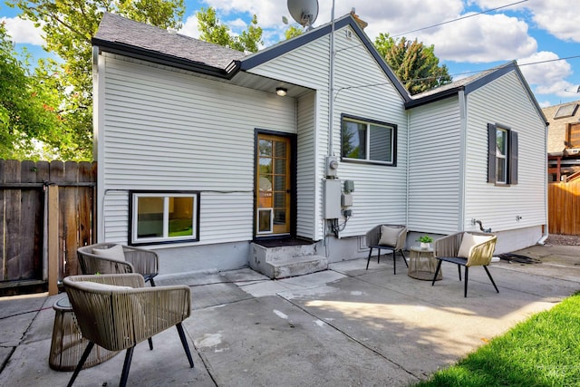 back of property with a patio area