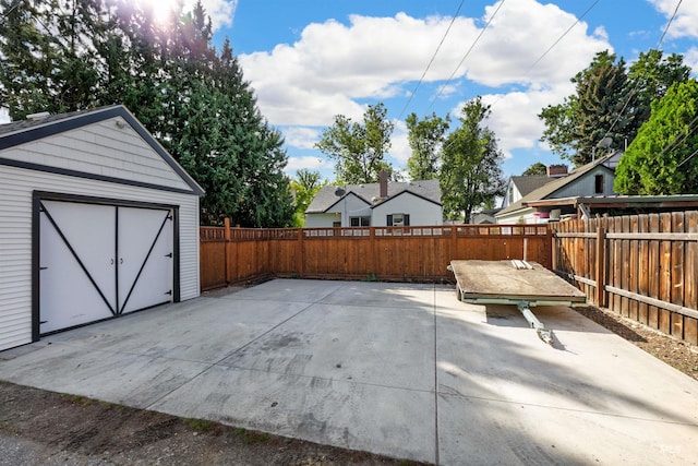 view of patio with a storage shed