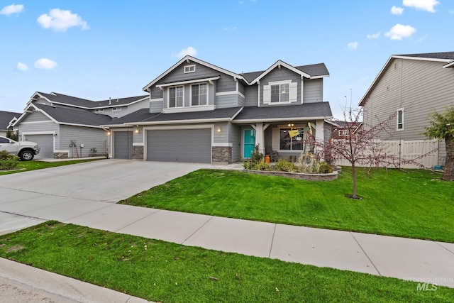 craftsman-style house with a garage and a front yard