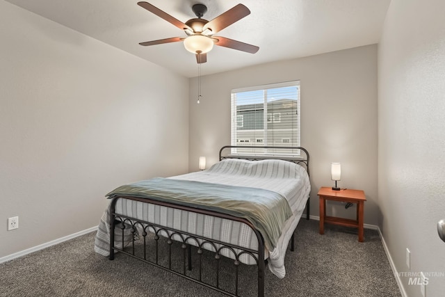 bedroom featuring dark colored carpet and ceiling fan