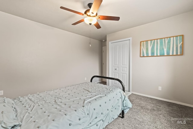 carpeted bedroom with a closet and ceiling fan