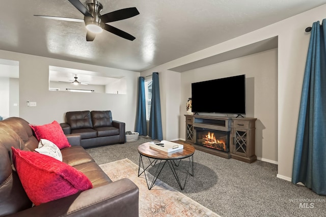 carpeted living room featuring ceiling fan