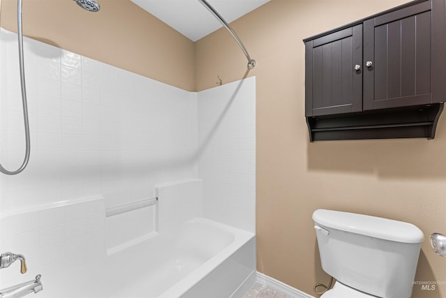 bathroom featuring toilet and washtub / shower combination