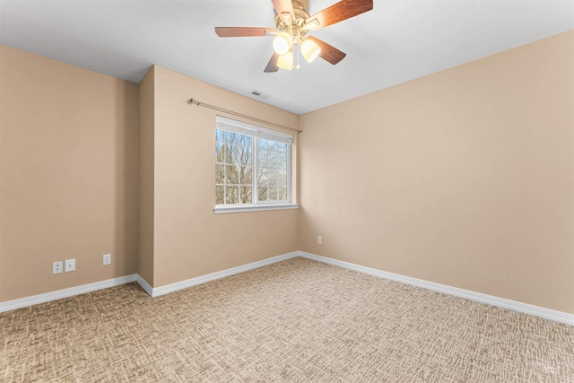 carpeted empty room with ceiling fan