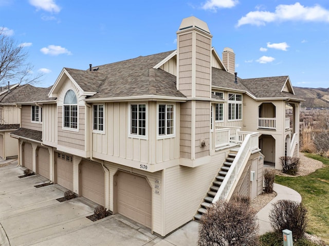 back of property with a garage