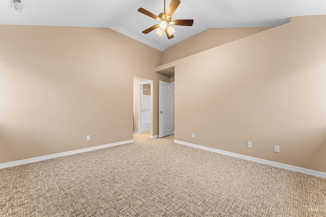 empty room featuring ceiling fan, light colored carpet, and lofted ceiling