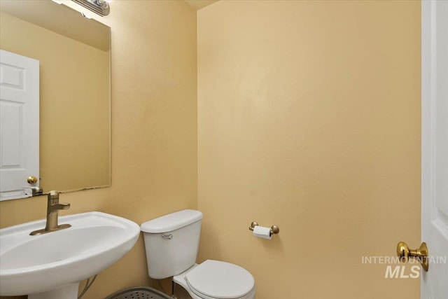 bathroom with a sink and toilet