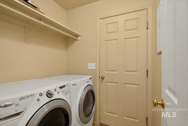 laundry area featuring laundry area and washing machine and dryer