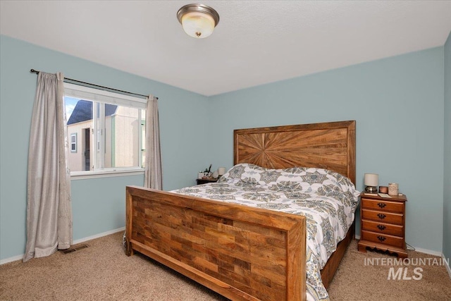 bedroom featuring carpet floors, baseboards, and visible vents