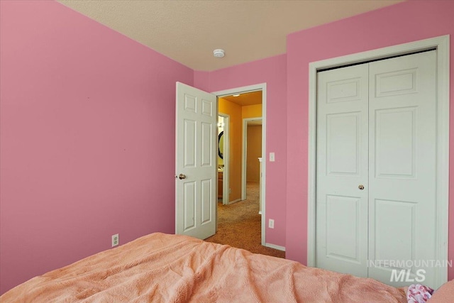 unfurnished bedroom featuring a closet and carpet flooring