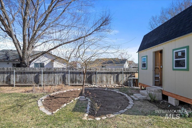 view of yard with a fenced backyard