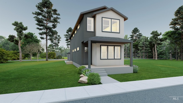 view of front facade featuring stucco siding and a front yard