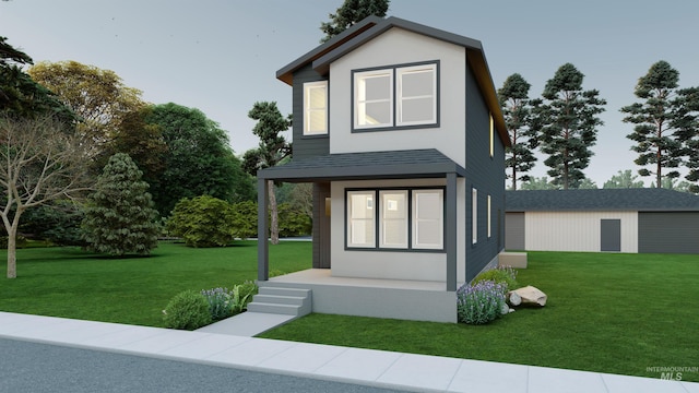 view of front of property featuring a shingled roof, a front yard, a porch, and stucco siding