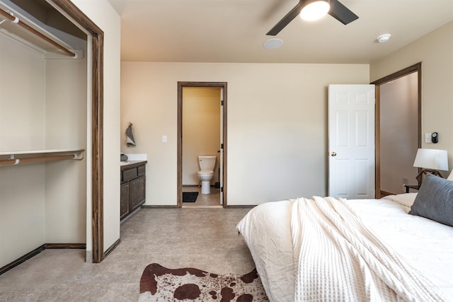 406 Margaret Way, Mccall, ID 83638 - bedroom with light floors, baseboards, ensuite bath, a ceiling fan, and a closet
