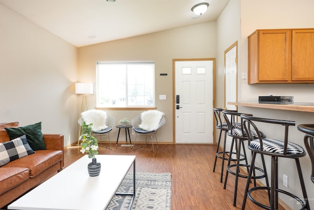 406 Margaret Way, Mccall, ID 83638 - living room with lofted ceiling, light wood-type flooring, and baseboards