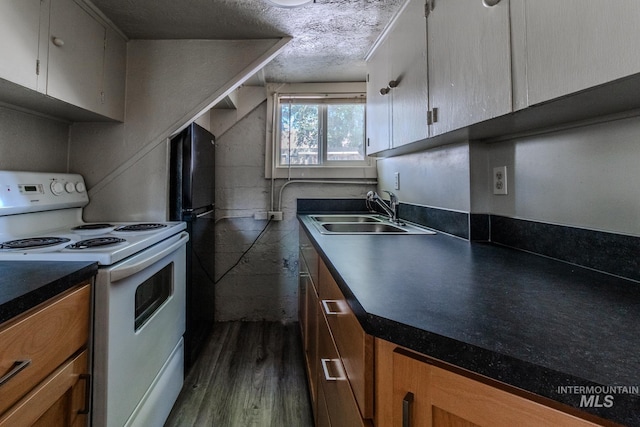 kitchen featuring sink, white electric range oven, a textured ceiling, and dark hardwood / wood-style floors