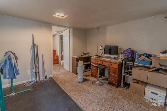 carpeted office with a textured ceiling