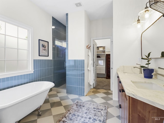 1262 N Forestdale Pl, Eagle, ID 83616 - full bath with tile patterned floors, a stall shower, double vanity, tile walls, and a freestanding bath
