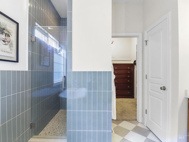1262 N Forestdale Pl, Eagle, ID 83616 - full bathroom featuring a shower stall, tile patterned floors, a wainscoted wall, and tile walls