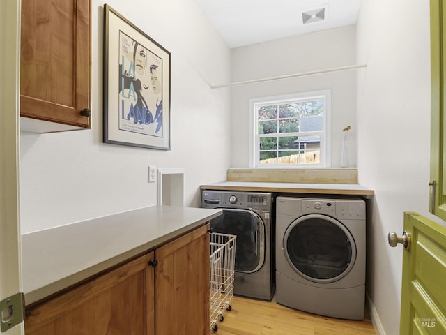 1262 N Forestdale Pl, Eagle, ID 83616 - washroom with cabinet space, separate washer and dryer, and light wood finished floors
