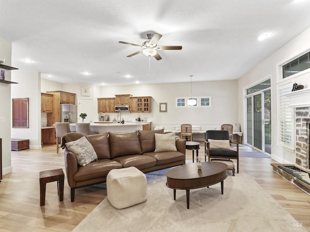 1262 N Forestdale Pl, Eagle, ID 83616 - living room featuring light wood-type flooring, a ceiling fan, and recessed lighting