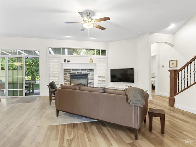 1262 N Forestdale Pl, Eagle, ID 83616 - living area featuring ceiling fan, light wood finished floors, stairway, and a fireplace