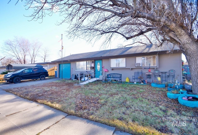 ranch-style house with driveway and an attached garage