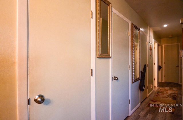 corridor with recessed lighting and wood finished floors