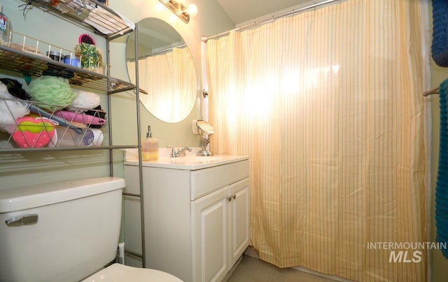 bathroom with vanity and toilet