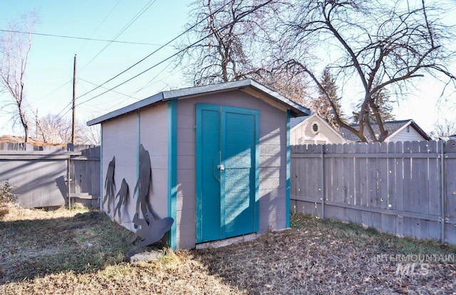 view of shed with fence