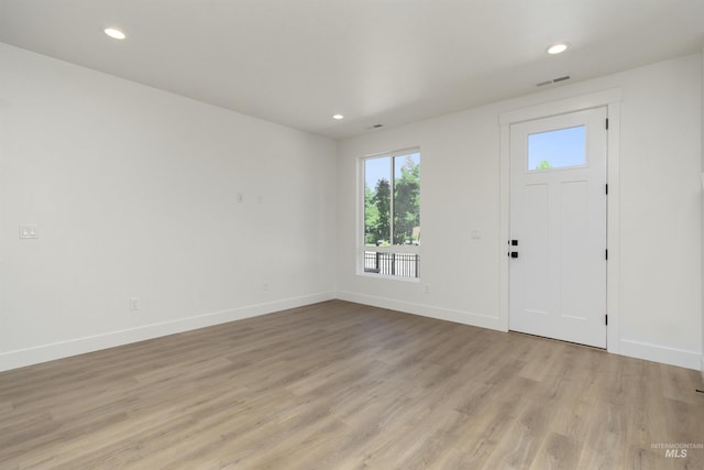 foyer with light hardwood / wood-style floors