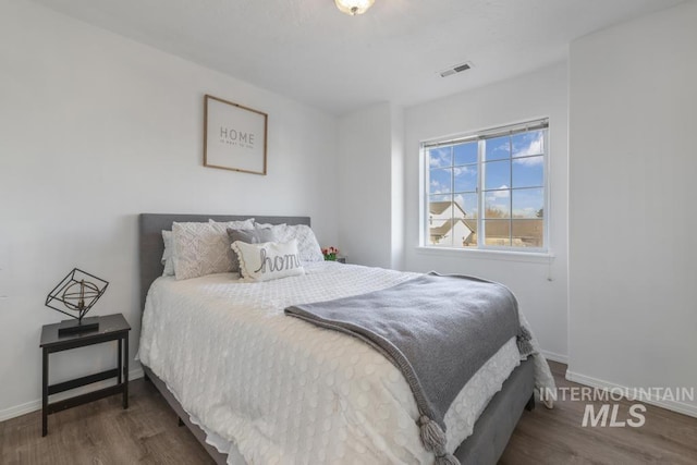 bedroom featuring dark hardwood / wood-style floors