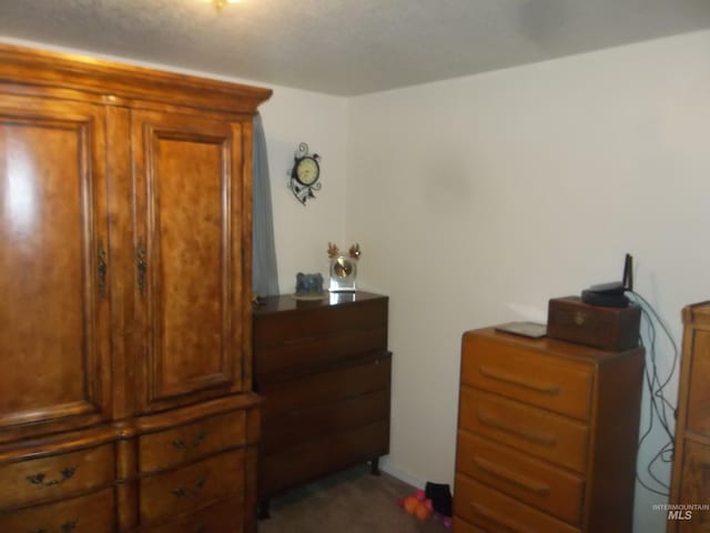 bedroom featuring dark colored carpet