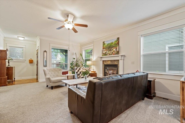 3931 N Park Crossing Ave, Meridian, ID 83646 - living area featuring light carpet, ceiling fan, a premium fireplace, and crown molding