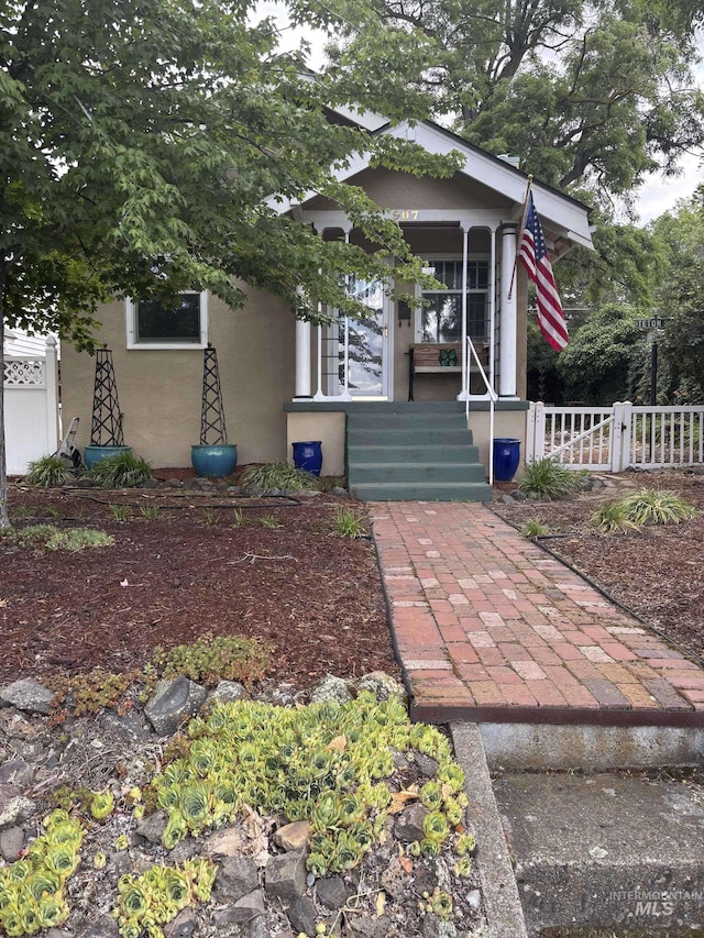 907 Prospect Ave, Lewiston, ID 83501 - view of front of house featuring stucco siding and covered porch