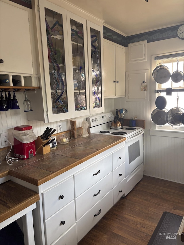 907 Prospect Ave, Lewiston, ID 83501 - kitchen featuring white electric range oven, tile counters, white cabinetry, and glass insert cabinets