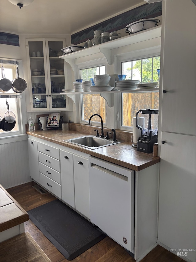 907 Prospect Ave, Lewiston, ID 83501 - kitchen featuring dishwasher, white cabinets, dark wood-type flooring, glass insert cabinets, and open shelves