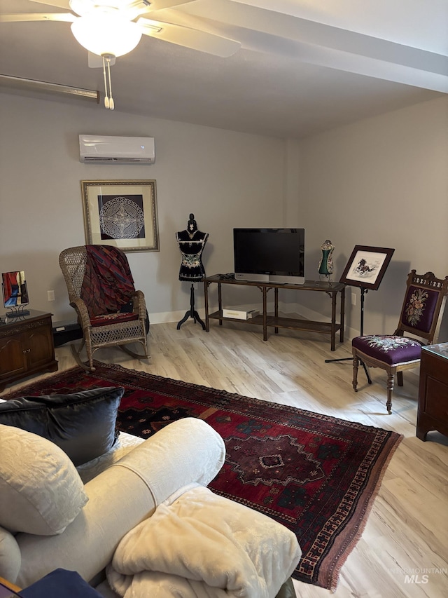 907 Prospect Ave, Lewiston, ID 83501 - living area featuring a wall mounted AC, wood finished floors, and a ceiling fan