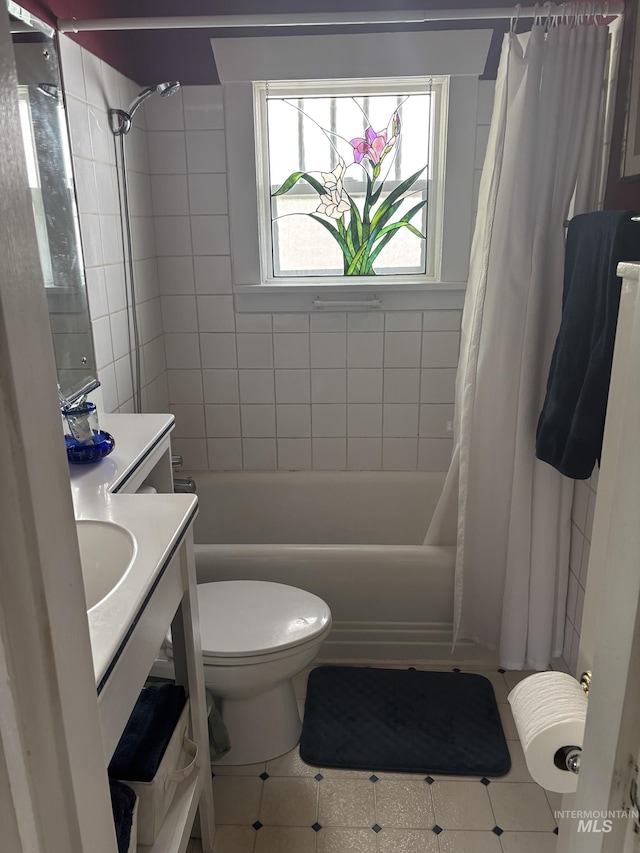 907 Prospect Ave, Lewiston, ID 83501 - bathroom with tile patterned floors, vanity, and shower / bath combination with curtain