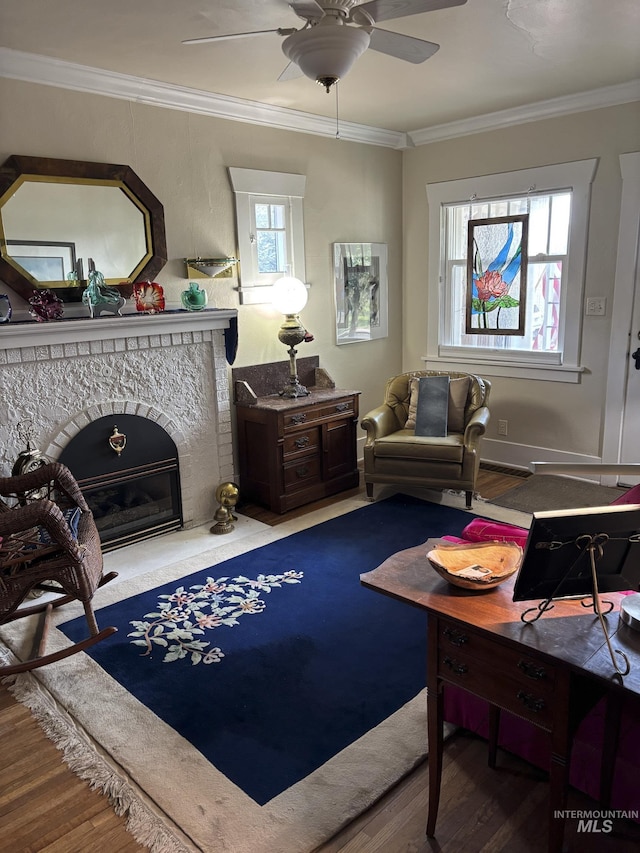 907 Prospect Ave, Lewiston, ID 83501 - living area with a ceiling fan, wood finished floors, ornamental molding, and a fireplace