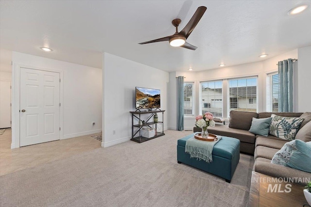 living area with recessed lighting, baseboards, a ceiling fan, and light colored carpet