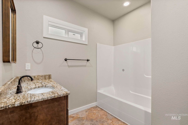 bathroom with vanity and shower / bathtub combination