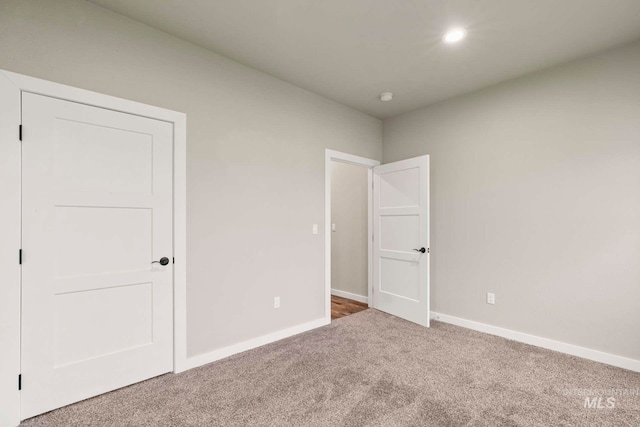 unfurnished bedroom with carpet flooring