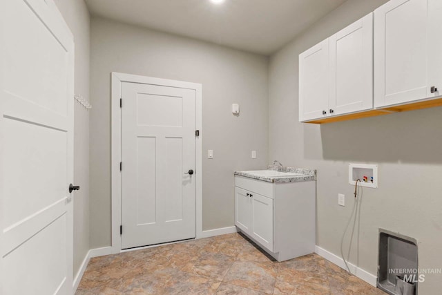 laundry room featuring cabinets, sink, and washer hookup