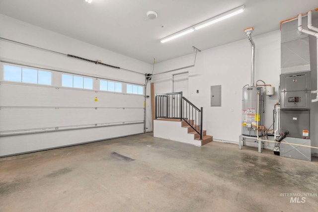 garage with water heater and electric panel