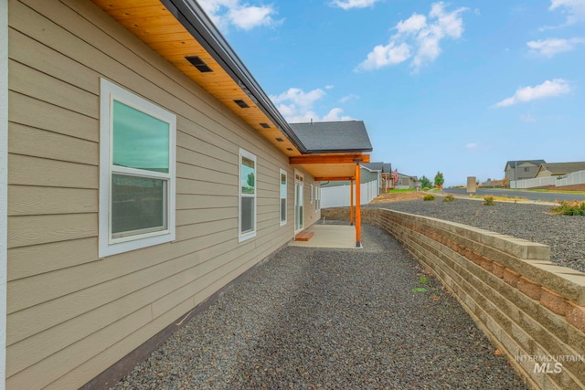 view of property exterior featuring a patio