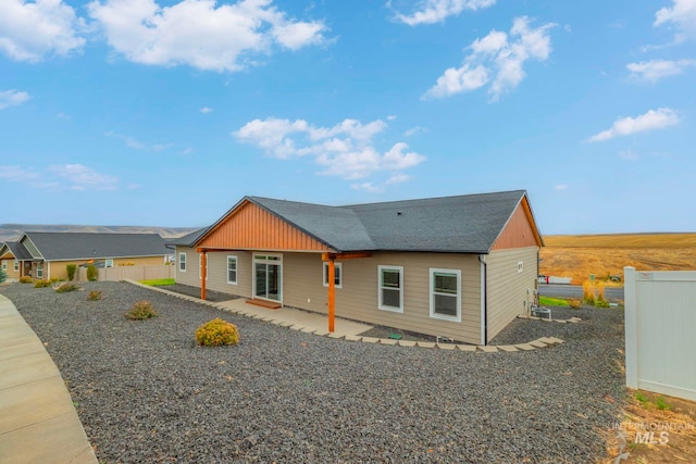 view of front of home featuring a patio area and central AC