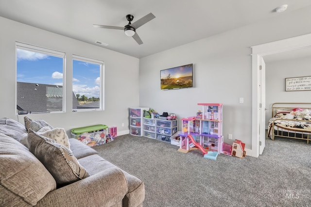 playroom with carpet, visible vents, ceiling fan, and baseboards