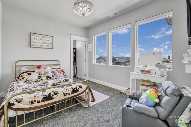 bedroom featuring dark carpet, visible vents, and baseboards