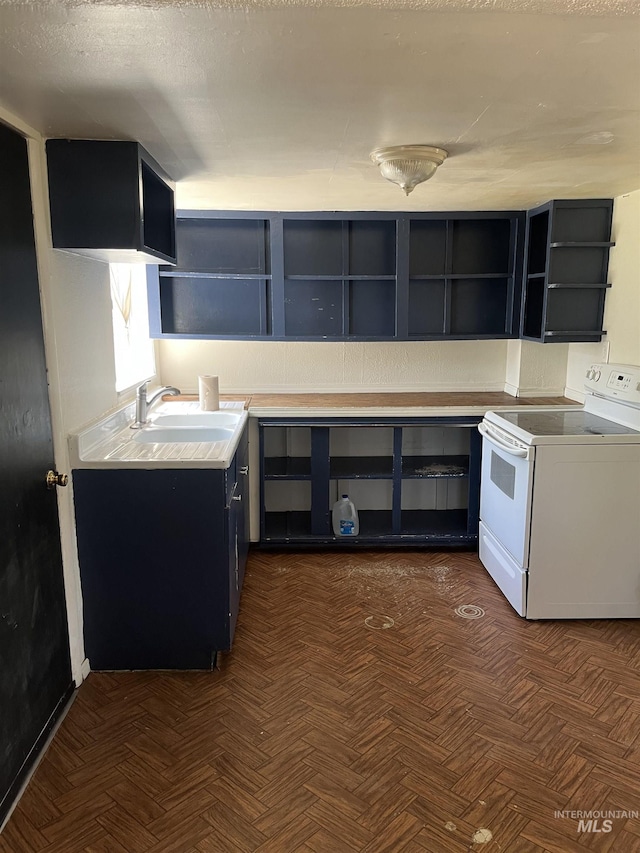 11543 W State St, Star, ID 83669 - kitchen with white electric range oven, open shelves, dark cabinetry, and light countertops